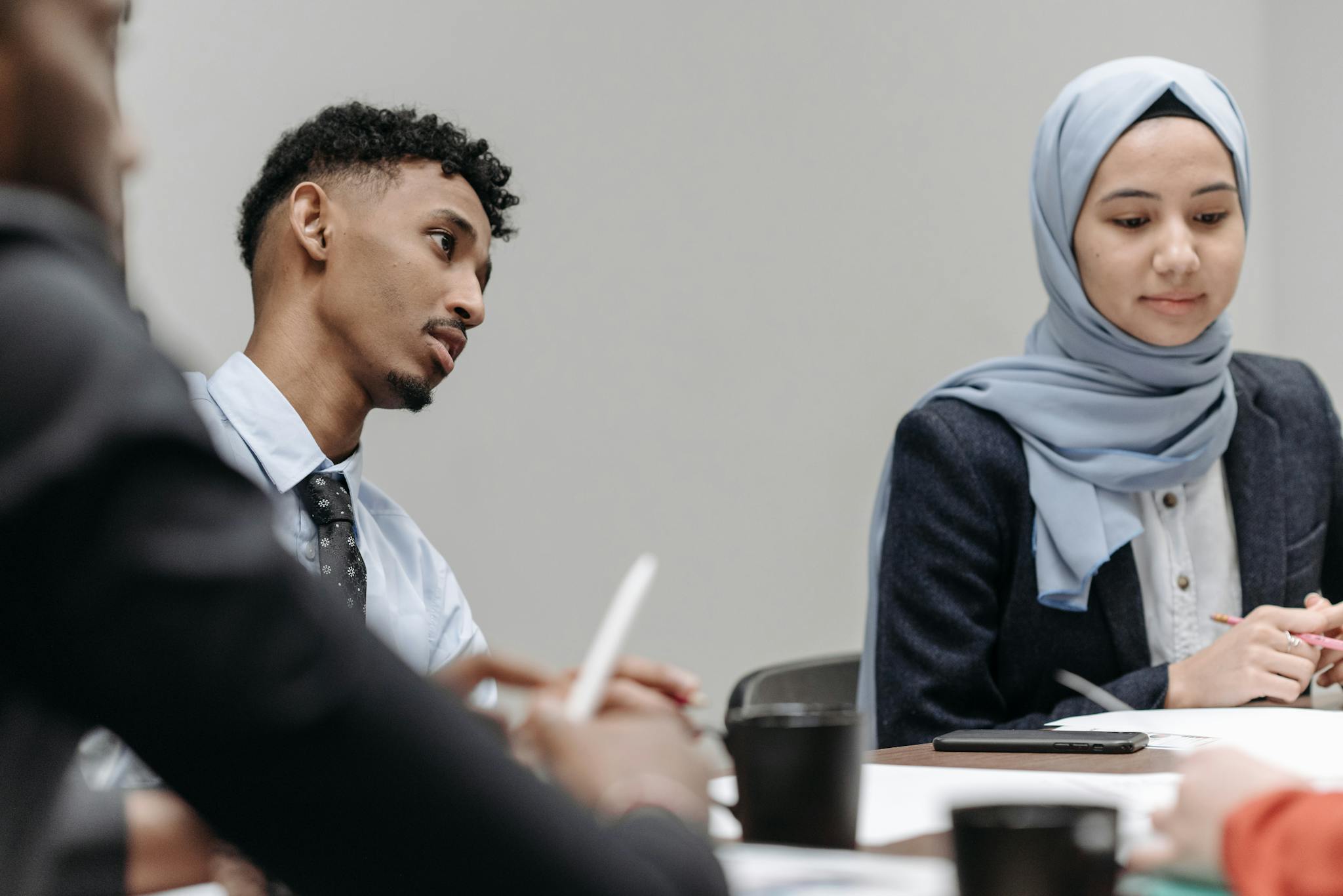 Multicultural professionals collaborating in a modern office setting.